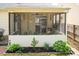 Enjoy the outdoors in this screened-in porch with ceiling fan and lush landscaping at 59 Tuscarora Ln, Clayton, NC 27520