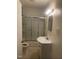 Functional bathroom featuring a shower-tub combo and sleek vanity at 610 W Old Rd, Lillington, NC 27546
