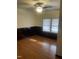Well-lit bedroom featuring wood-look flooring and ample natural light at 610 W Old Rd, Lillington, NC 27546