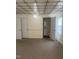 Cozy room with carpet, adjacent to a bathroom, featuring classic wall and ceiling details at 610 W Old Rd, Lillington, NC 27546