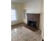 Inviting living room with a classic brick fireplace and built-in display shelves at 610 W Old Rd, Lillington, NC 27546