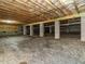 Unfinished basement with exposed beams and foundation, offering potential for customization and additional living space at 65 N Wilders Ridge Way, Clayton, NC 27527