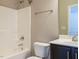 Bright bathroom featuring a vanity, toilet, and shower with chrome fixtures at 65 N Wilders Ridge Way, Clayton, NC 27527