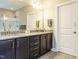 Bathroom with double vanity, granite countertop, and walk-in shower at 65 N Wilders Ridge Way, Clayton, NC 27527