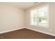 Bright bedroom with neutral walls and carpet, and a window with blinds at 65 N Wilders Ridge Way, Clayton, NC 27527