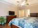 Spacious bedroom featuring hardwood floors, ceiling fan, and natural light at 65 N Wilders Ridge Way, Clayton, NC 27527