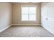 Bedroom with neutral walls, carpeting, and ample natural light at 65 N Wilders Ridge Way, Clayton, NC 27527