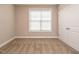 Bedroom featuring neutral walls, carpet, a window with blinds, and a closet at 65 N Wilders Ridge Way, Clayton, NC 27527