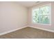 Bedroom featuring neutral walls and carpet, and a window with blinds at 65 N Wilders Ridge Way, Clayton, NC 27527