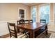 View of dining room showcasing a wooden table, chairs, and the kitchen at 65 N Wilders Ridge Way, Clayton, NC 27527