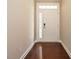 Inviting entryway featuring hardwood floors and a white door with glass accents at 65 N Wilders Ridge Way, Clayton, NC 27527