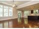 Open living area featuring hardwood floors and a seamless connection to the kitchen at 65 N Wilders Ridge Way, Clayton, NC 27527