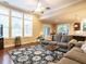 Open concept living room and kitchen area with hardwood floors and ceiling fan at 65 N Wilders Ridge Way, Clayton, NC 27527