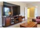 Well-appointed living room with a large TV, console, and comfortable seating arrangement at 65 N Wilders Ridge Way, Clayton, NC 27527