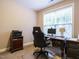 Comfortable home office with a computer, printer, and ergonomic chair at 65 N Wilders Ridge Way, Clayton, NC 27527