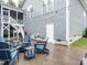 Backyard patio with a fire pit and comfortable seating, perfect for relaxing outdoors at 65 N Wilders Ridge Way, Clayton, NC 27527