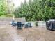 Outdoor patio area with stylish seating, string lights, and a grill for entertaining at 65 N Wilders Ridge Way, Clayton, NC 27527