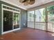 Inviting screened-in porch featuring wood flooring and easy access to the outdoor living area at 65 N Wilders Ridge Way, Clayton, NC 27527