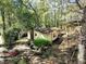 Aerial view of the house surrounded by mature trees and foliage, creating a private setting at 6709 Johnsdale Rd, Raleigh, NC 27615