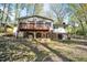 View of back of the house featuring a wooden deck with access to the second story at 6709 Johnsdale Rd, Raleigh, NC 27615