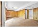 Large basement area with neutral carpet and paneled walls, ready for finishing at 6709 Johnsdale Rd, Raleigh, NC 27615