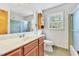 A well-lit bathroom offers a vanity with generous counter space and a shower with glass doors at 6709 Johnsdale Rd, Raleigh, NC 27615