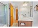 Bathroom featuring a shower, a vanity, and a marble countertop at 6709 Johnsdale Rd, Raleigh, NC 27615