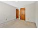 Bedroom with carpeting, a double closet, and an adjoining bathroom at 6709 Johnsdale Rd, Raleigh, NC 27615
