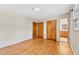 Bedroom featuring hardwood floors, a double closet, and an attached bathroom at 6709 Johnsdale Rd, Raleigh, NC 27615