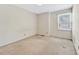 Bedroom with a window and carpet at 6709 Johnsdale Rd, Raleigh, NC 27615