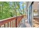 View from the deck showcases an outdoor deck area with scenic views of the surrounding trees at 6709 Johnsdale Rd, Raleigh, NC 27615