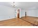 The spacious living room boasts hardwood floors and leads to the kitchen, creating a seamless living space at 6709 Johnsdale Rd, Raleigh, NC 27615