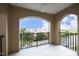 Open-air balcony with black railing, offering a serene outdoor space with community views at 700 Finsbury St # 306, Durham, NC 27703