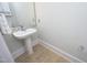 Bathroom with decorative backsplash and a pedestal sink at 700 Finsbury St # 306, Durham, NC 27703