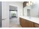 Modern bathroom featuring a beautiful vanity, decorative mirror and tile accent wall at 700 Finsbury St # 306, Durham, NC 27703