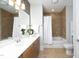 Bathroom with vanity and tile flooring with updated tile shower and bath at 700 Finsbury St # 306, Durham, NC 27703