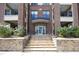 Apartment building entrance with stone stairs and well-maintained landscaping at 700 Finsbury St # 306, Durham, NC 27703