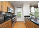 Well-equipped kitchen featuring stainless steel appliances and granite countertops at 700 Finsbury St # 306, Durham, NC 27703