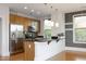 Modern kitchen features stainless steel appliances, granite countertops, and pendant lighting at 700 Finsbury St # 306, Durham, NC 27703