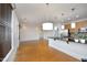 Bright living room with hardwood floors, modern lighting, and open kitchen concept at 700 Finsbury St # 306, Durham, NC 27703