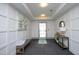Inviting lobby space with stylish paneling, decor, carpet, bench seating and elevator access at 700 Finsbury St # 306, Durham, NC 27703