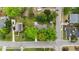 An aerial view of a property nestled among mature trees in a residential neighborhood at 703 E Horne St, Clayton, NC 27520