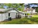 The side of the house is shown, as well as a pergola and an outdoor seating set at 703 E Horne St, Clayton, NC 27520