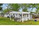 Cozy backyard features a white pergola and seating area, perfect for outdoor relaxation at 703 E Horne St, Clayton, NC 27520