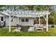 A backyard has a pergola and patio seating set at 703 E Horne St, Clayton, NC 27520