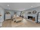 Tranquil bedroom showcasing a decorative fireplace, ample space, and stylish decor at 703 E Horne St, Clayton, NC 27520