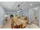Bright dining room with hardwood floors and view into living room, lots of space for entertaining at 703 E Horne St, Clayton, NC 27520