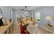 Cozy dining area featuring wood floors, table with seating, and view of the kitchen at 703 E Horne St, Clayton, NC 27520