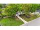 Charming single-story home with a well-manicured front yard, mature trees, and inviting curb appeal at 703 E Horne St, Clayton, NC 27520