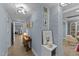 A cozy hallway is lined with decorative art and lighting, connecting different areas of the home at 703 E Horne St, Clayton, NC 27520